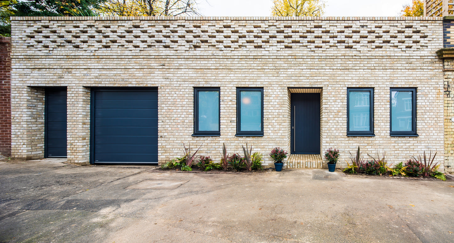 View of a double-glazed entrance panel door in an Ugly House to Lovely House project.