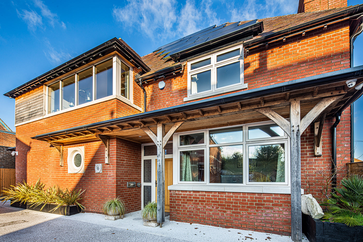 External view of a triple-glazed, aluminum-clad feature in a premium new build.