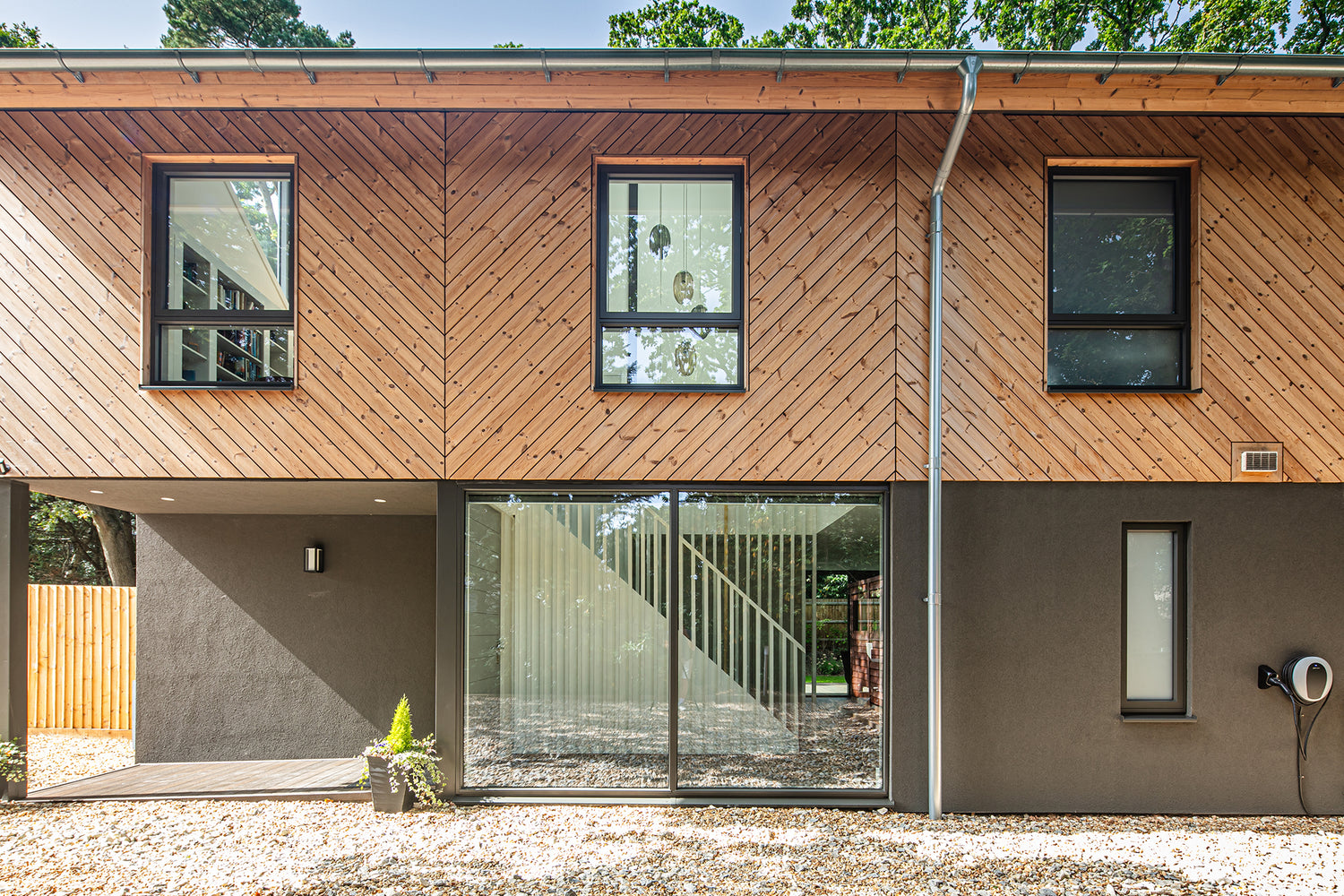 External view of a triple-glazed, aluminum-clad outward-opening window in a funky Dorset new build.