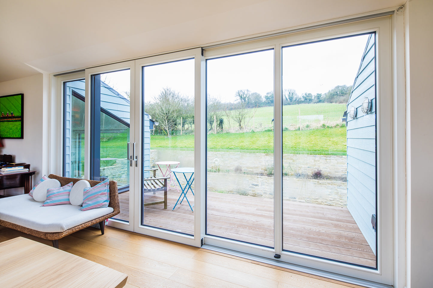 Internal view of a double-glazed, aluminum-clad door in a countryside retreat.