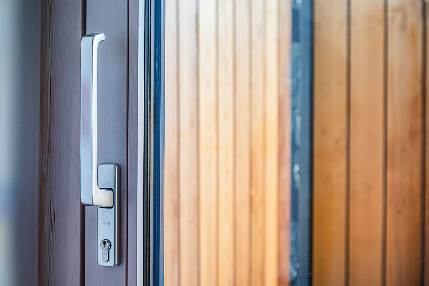 View of a triple-glazed, aluminum-clad handle in a modern funeral home.