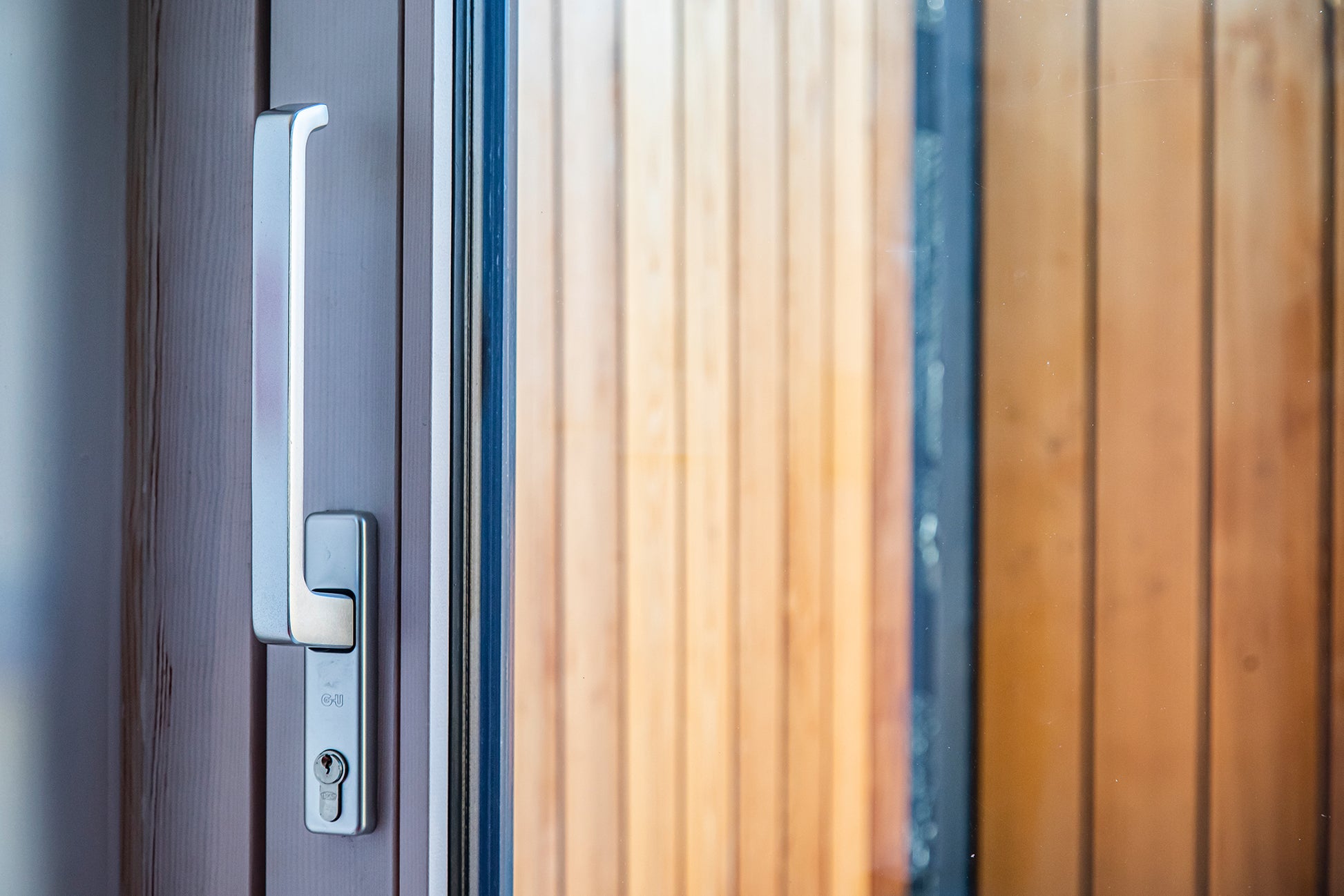 View of a triple-glazed, aluminum-clad handle in a modern funeral home.