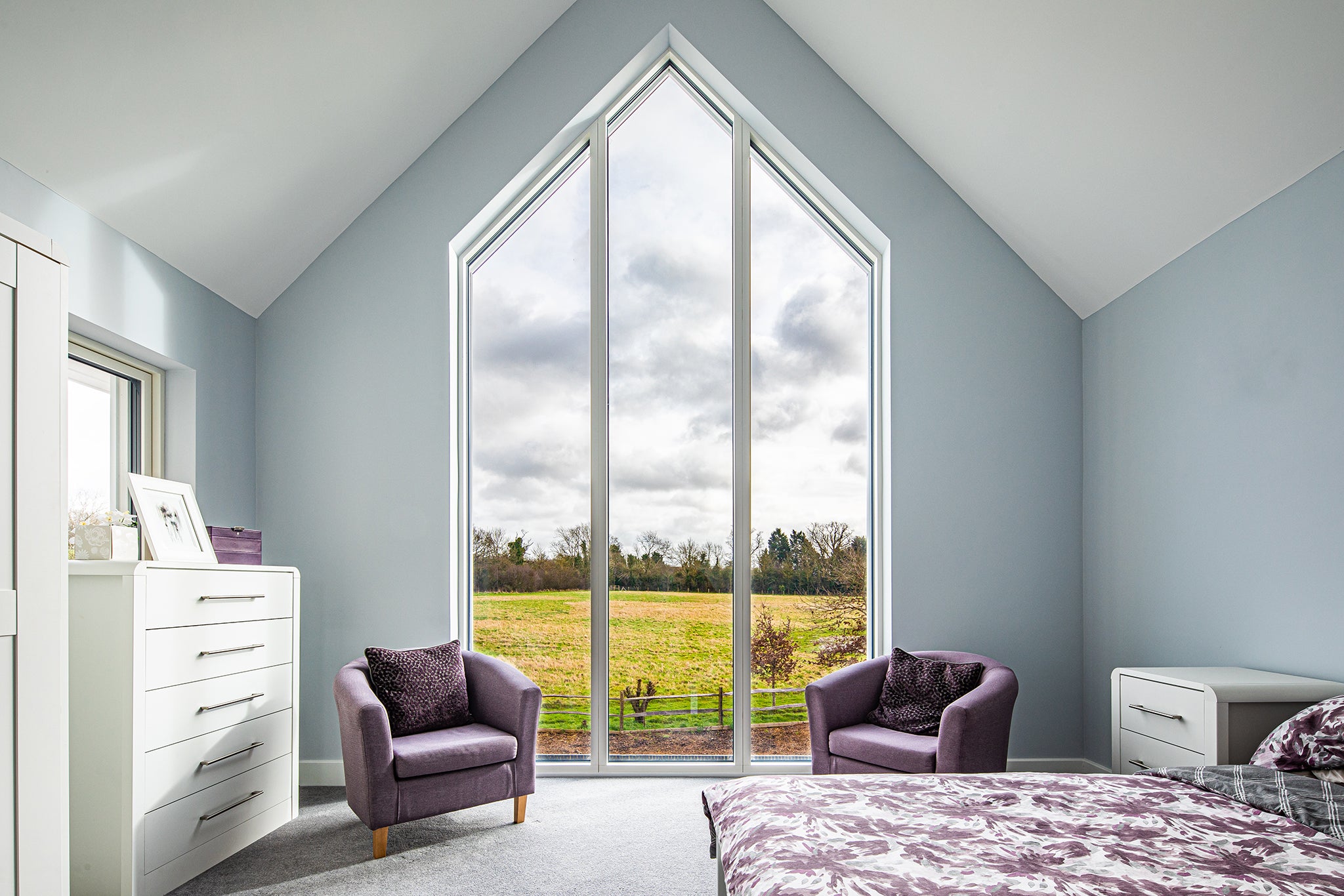Internal view of a triple-glazed, aluminum-clad timber long window in a Nordic-style home.