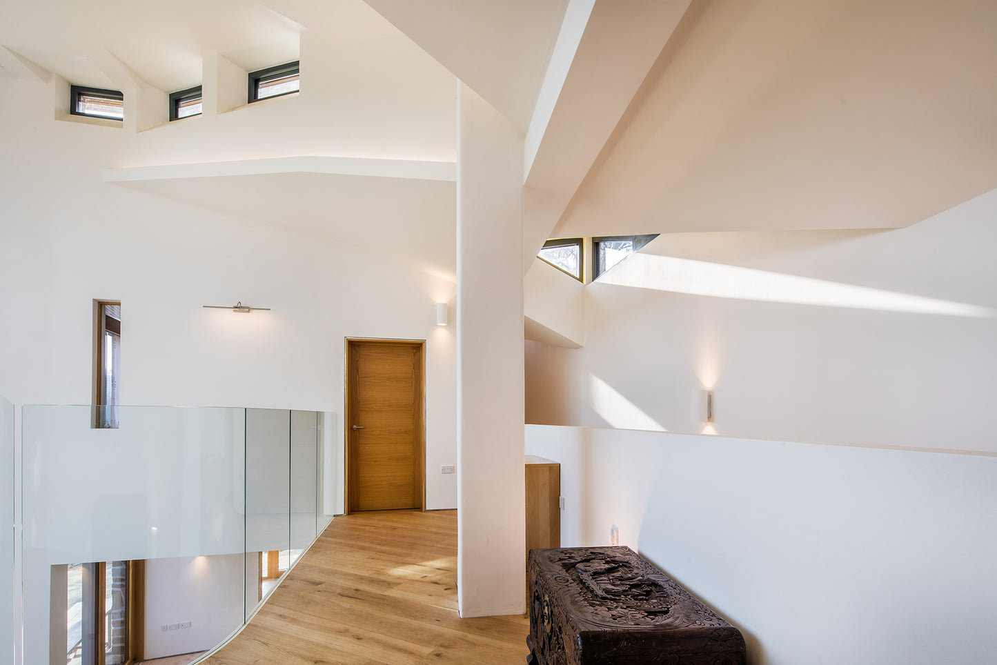 Hallway view of a triple-glazed, aluminum-clad door in a stunning passive house.