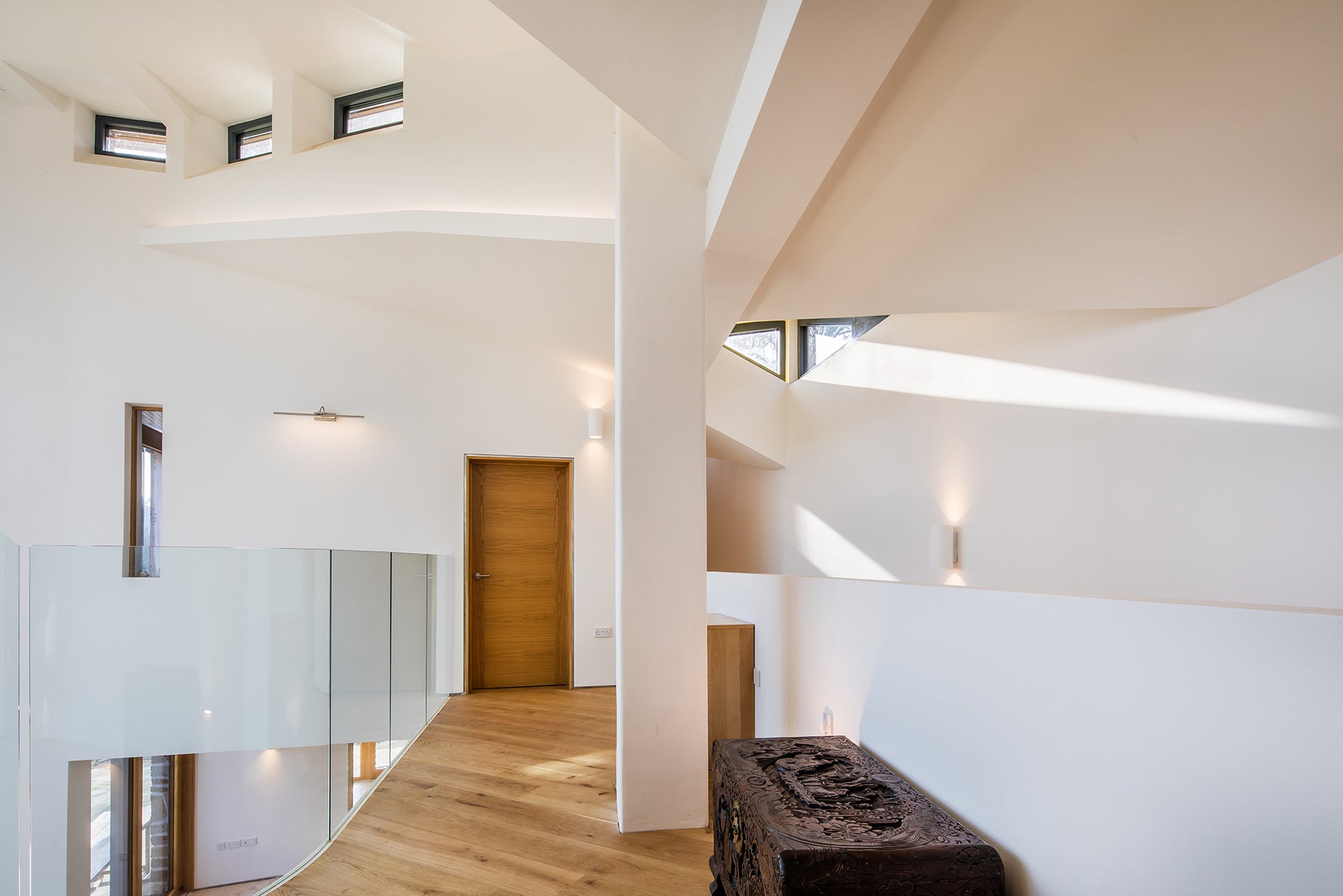 Hallway view of a triple-glazed, aluminum-clad door in a stunning passive house.