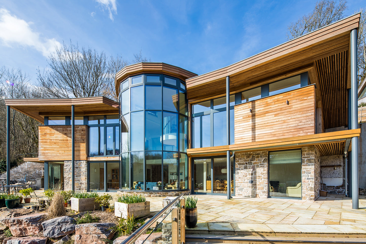 External view of a triple-glazed, aluminum-clad window and door in a stunning passive house.