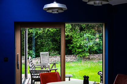 Interior view of a triple-glazed Enerphit sliding door in a high-performance retrofit.
