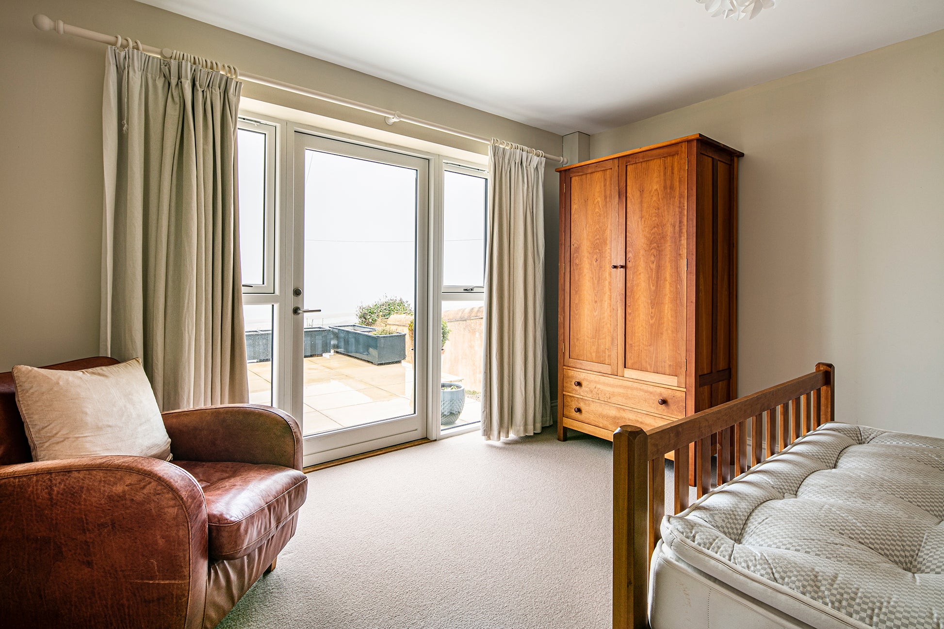 Internal view of a double-glazed, aluminum-clad framed door in a coastline renovation.
