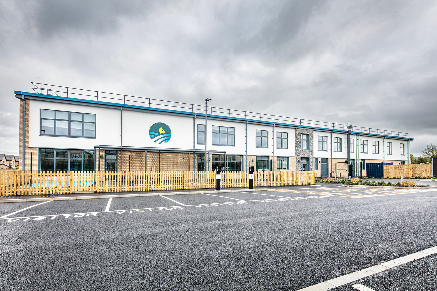 Front elevation view of triple-glazed features in a passive house school.