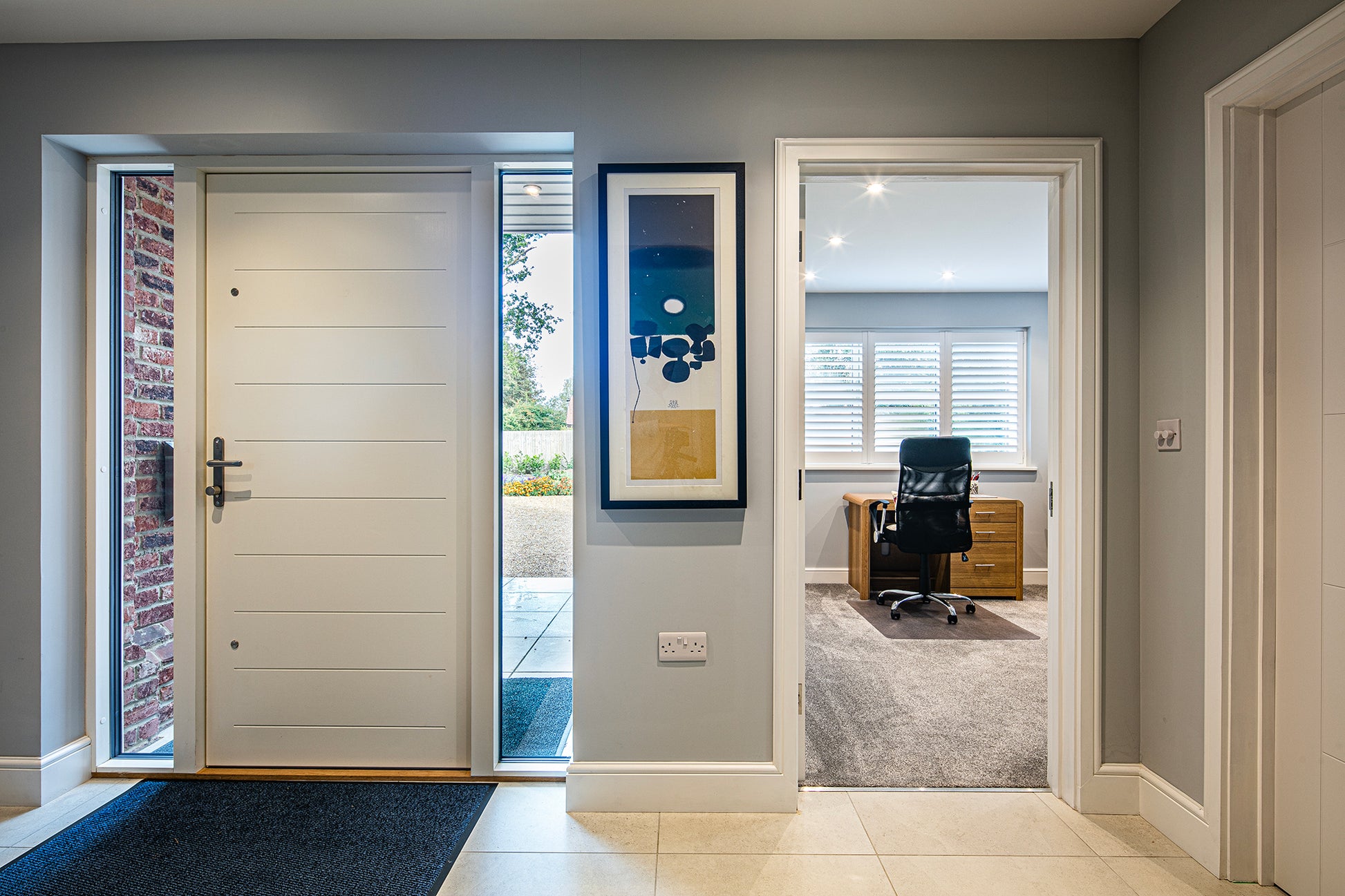 Internal view of a triple-glazed timber panel door in a traditional new build.