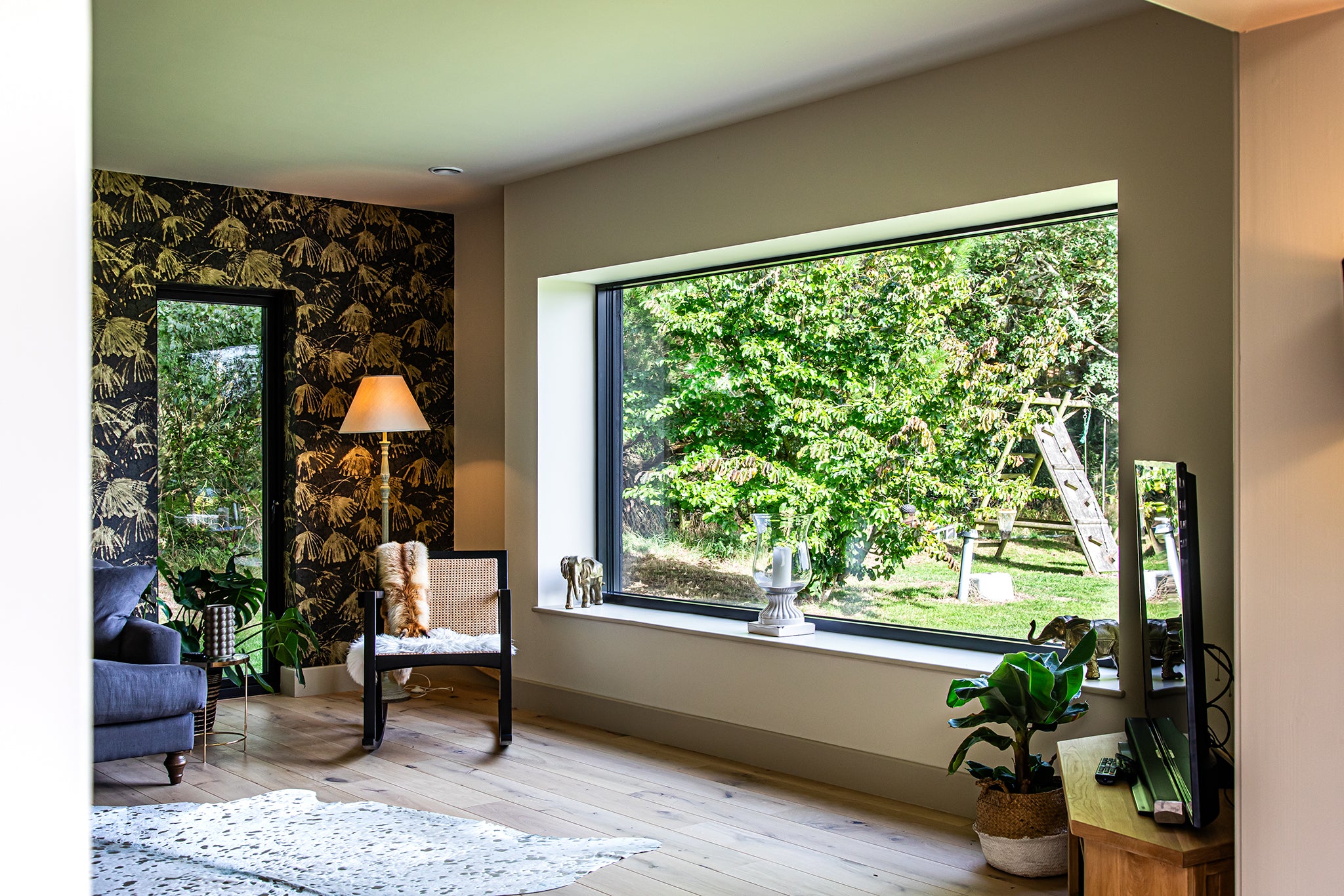Internal view of a triple-glazed, aluminum-clad large window in an award-winning low-energy home.