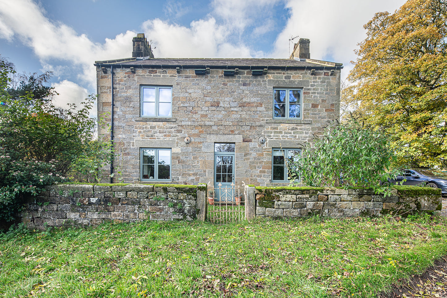 External view of a triple-glazed French door in a traditional refurbishment.