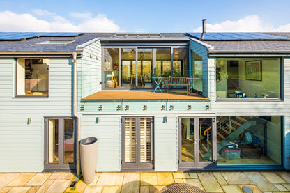 Rear elevation focus view of double-glazed features in a countryside retreat.