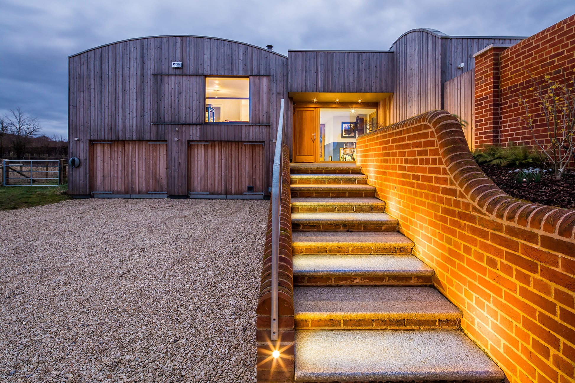 External view of a front entrance door in a barn-style low-energy home.