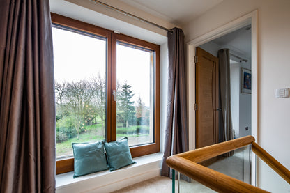 Internal view of a triple-glazed, aluminum-clad window in a rural passive house.