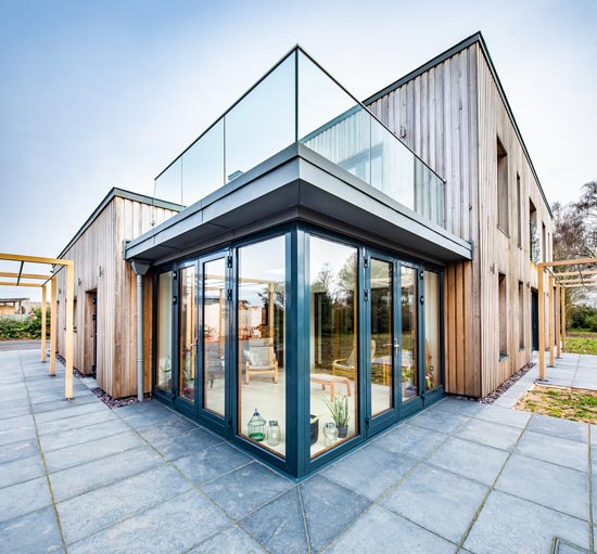 image of a glass box extension with dark grey french doors